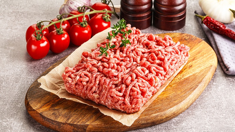 Raw ground beef on parchment paper