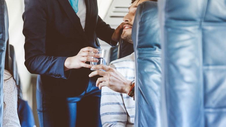Cup of water on plane