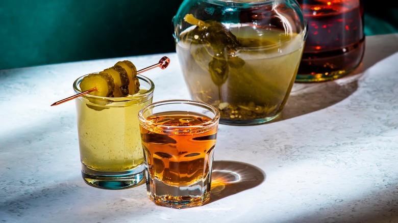 pickleback shot with skewered pickles