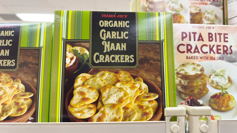 Shelf of Trader Joe's organic garlic naan crackers and pita bite crackers