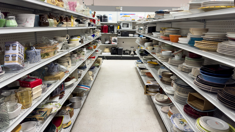 Thrift store aisle filled with kitchen goods