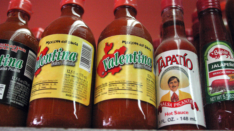 Various hot sauces on store shelf