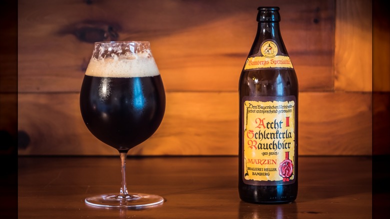 A glass of rauchbier with the original bottle