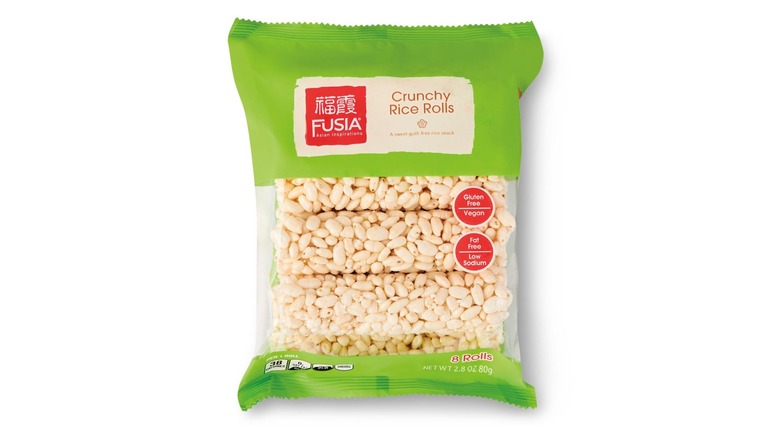 A green and clear plastic package of crunchy rice rolls