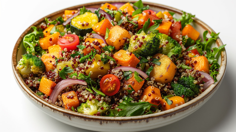 Roasted salad with quinoa and veggies in a plate