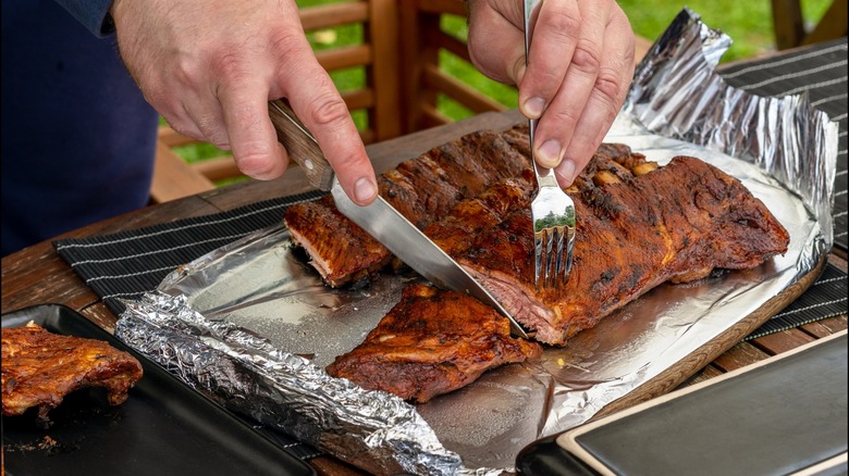 Barbecue ribs outside in foil