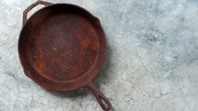 An old rusty cast-iron pan.