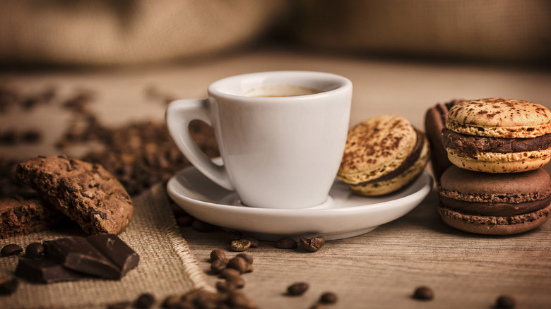 A cup of coffee on a wooden table.