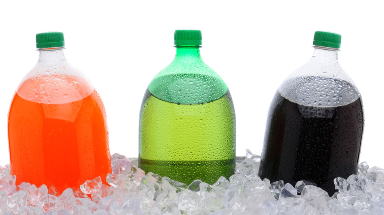 3 soda bottles in ice