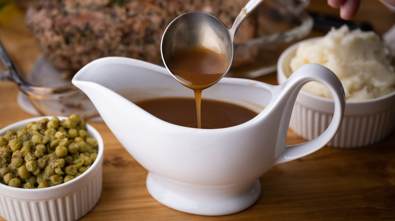brown gravy in a white ceramic gravy boat