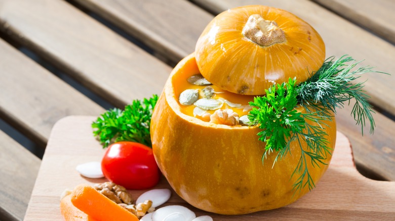 Soup in baked pumpkin bowl