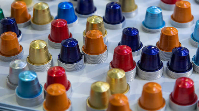 Empty coffee pods stacked in piles