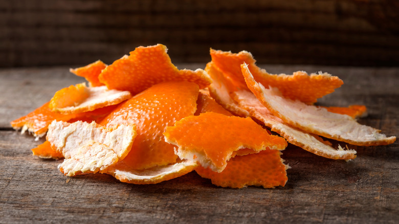 orange peels on a wooden board