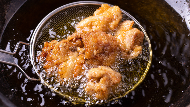 Deep frying chicken in oil