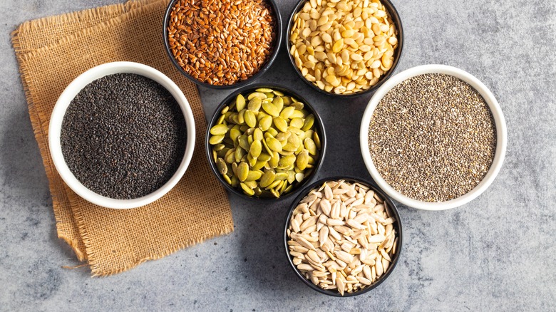 bowls filled with different kinds of seeds