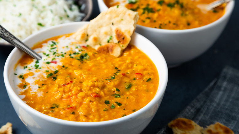 Bowl of lentil curry with a spoon