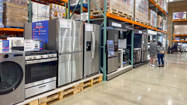 Couple shopping for appliances at Costco