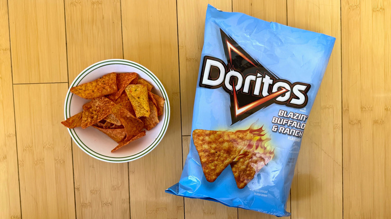 Bag of Blazin' Buffalo & Ranch Doritos beside filled bowl of chips