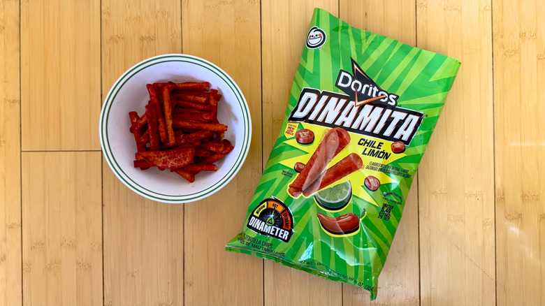 Bag of Dinamita Chile Limón Doritos beside filled bowl of rolled tortilla sticks