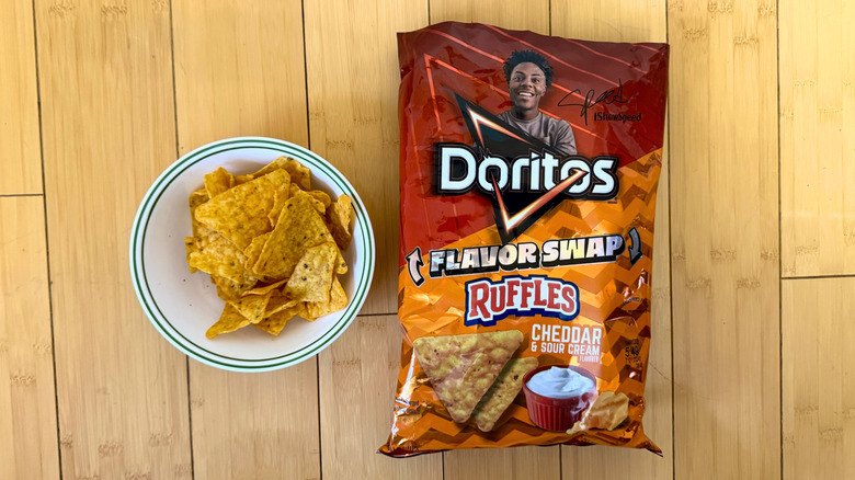 Bag of Flavor Swap Ruffles Cheddar & Sour Cream Doritos beside filled bowl of chips