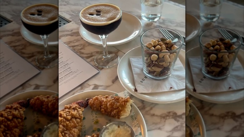 An espresso martini and an order of nuts at Summer House on the Lake