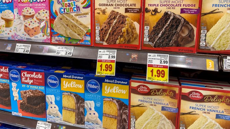 Variety of boxed cake mixes on shelves