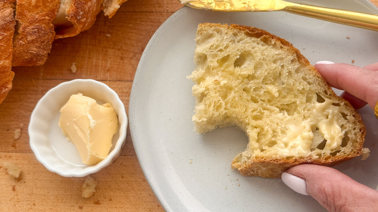 slice of bread on plate with butter