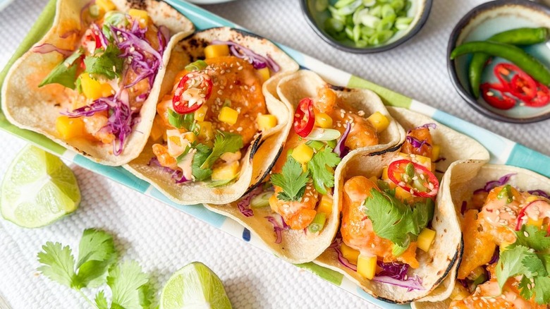 Dynamite shrimp tacos on serving platter