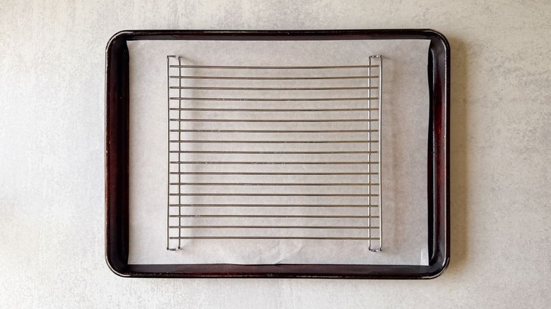 Baker's rack set over a parchment-lined baking sheet