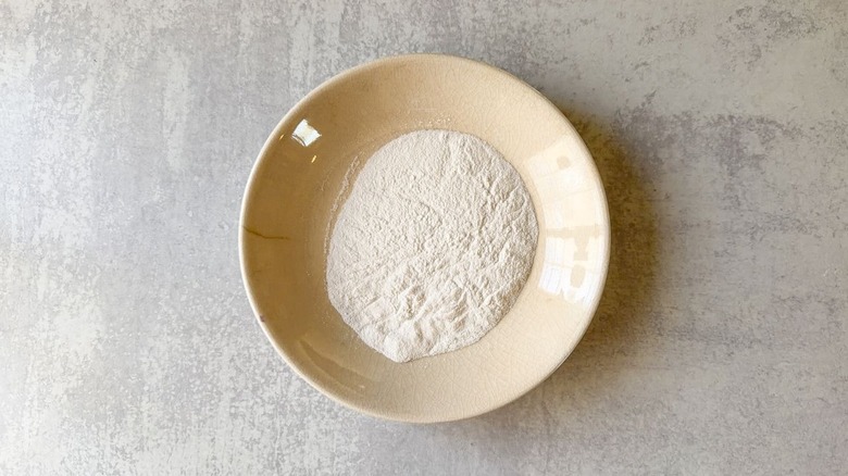 Cornstarch in shallow bowl on countertop
