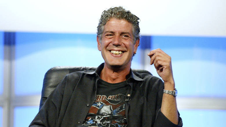 Celebrity chef Anthony Bourdain on stage at an event.