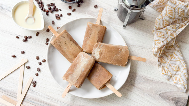 Easy 3-ingredient Vietnamese coffee popsicles on plate with French press