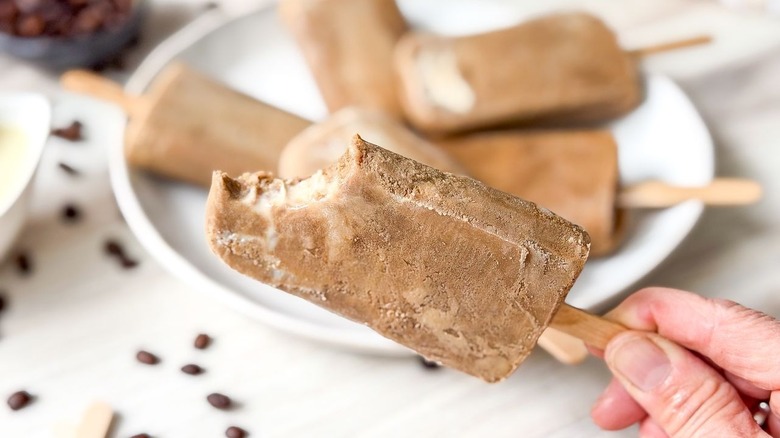 Vietnamese coffee popsicle with bite taken out