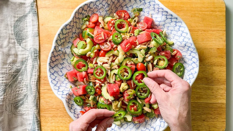 Watermelon salad with jalapeño pieces in a bowl