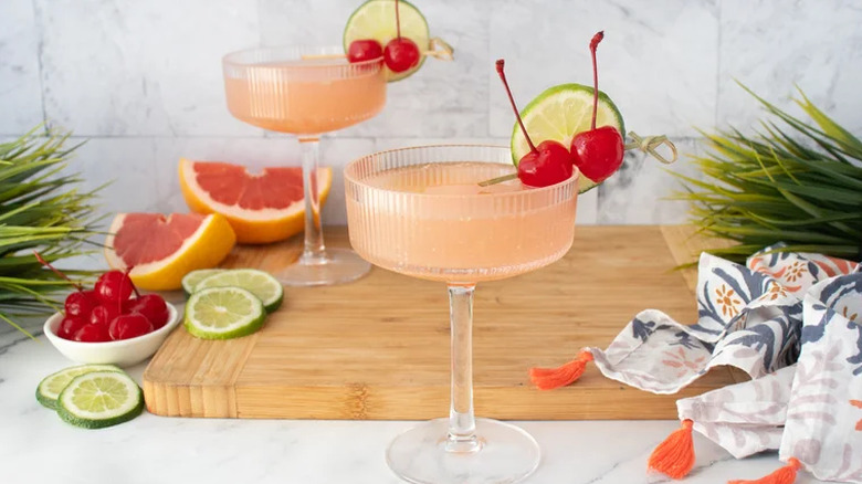 Two Classic Hemingway Daiquiris with cherry and cucumber garnish