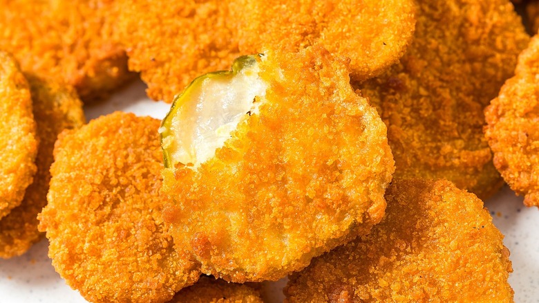 Close-up of fried pickles with a crunchy bread crumb coating