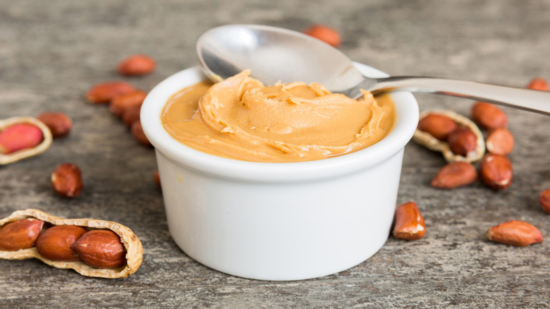 Ceramic white bowl of peanut butter.