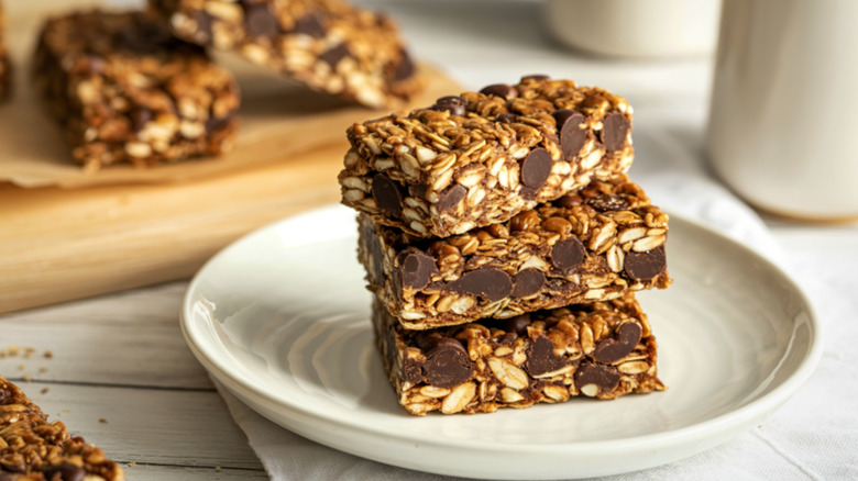 three homemade oats bars stacked on top of each other with chocolate chips