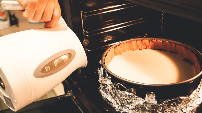 baking a cake with spring form pan and water bath