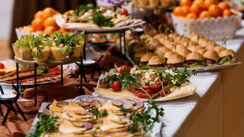 Assorted appetizers on trays in a buffet line