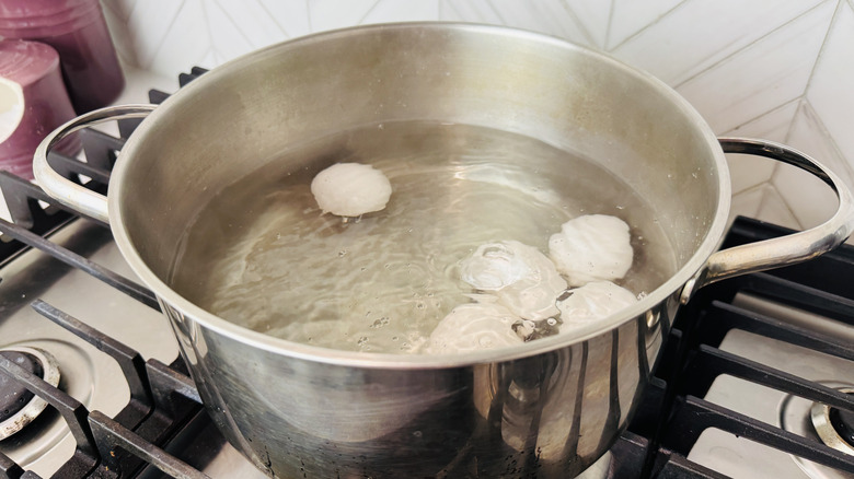 Eggs boiling in water