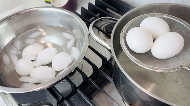 Transferring hard boiled eggs to an ice bath