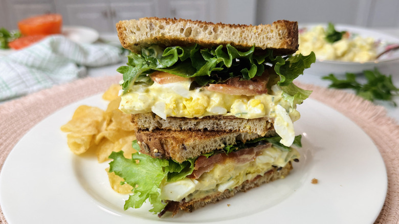 Egg salad club sandwich on plate