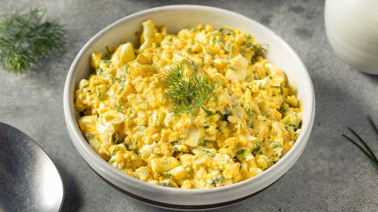 Bowl of egg salad with fresh dill