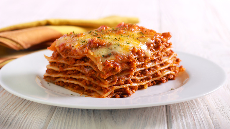 Slice of lasagna on plate selective focus