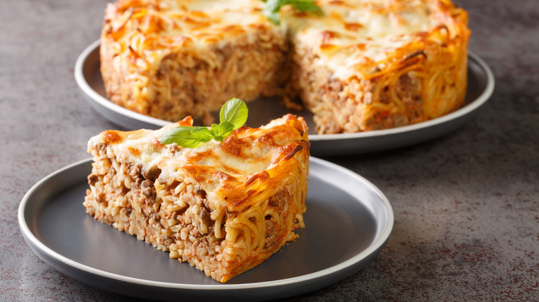 A slice of spaghetti pie on a plate.