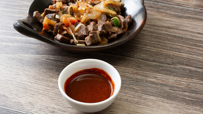 Awaze sauce next to tibs