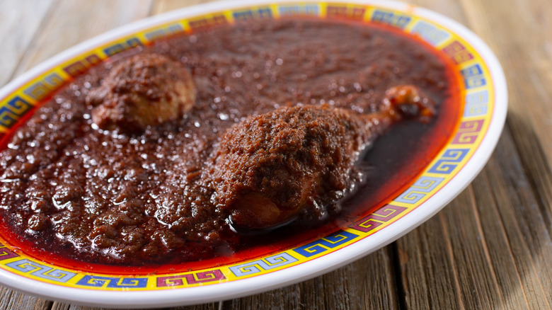 Doro wot chicken dish served in a white platter