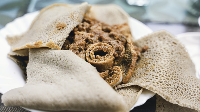 Rolls of injera on a plate