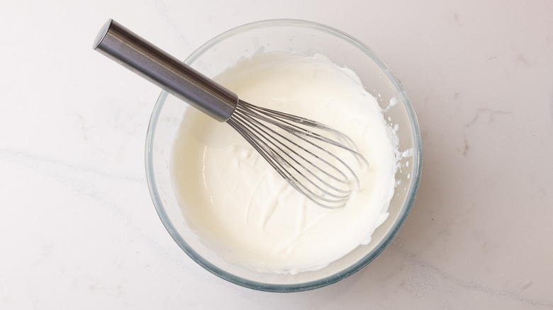 softly whipped cream in bowl